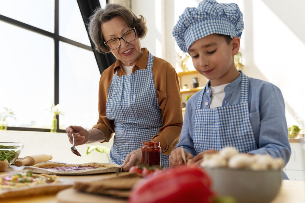 Grandmother and grandson cooking a cherished family recipe for a legacy video